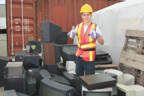 Construction site with builders managing waste clearance